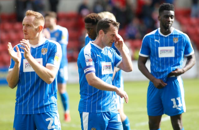 Notts County players react to their relegation from the league for the first time in their history after a 3-1 defeat at Swindon 