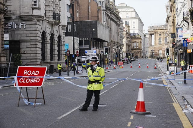 A police officer at the scene in Water Street near the Liver Building in Liverpool