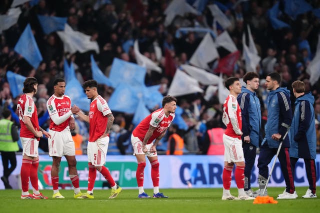 Arsenal players look dejected after their Carabao Cup final defeat