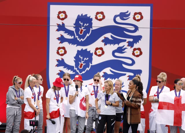 England captain Leah Williamson, centre, speaks on stage in Trafalgar Square