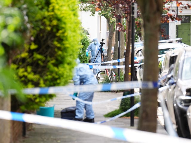 A forensics officer at the scene of the incident in Kentish Town