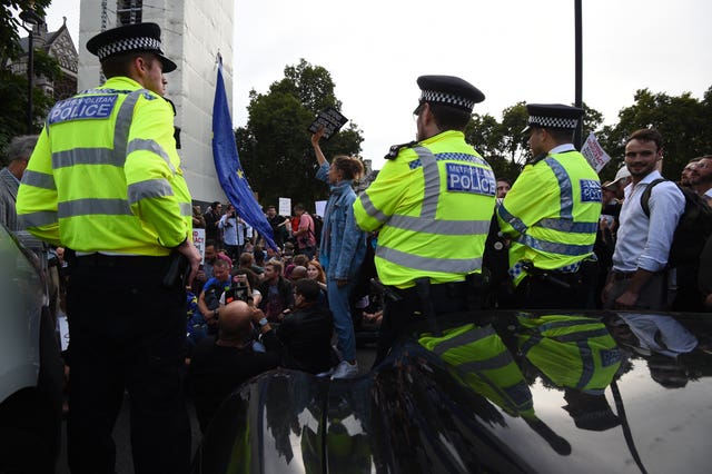 Protesters stop traffic outside the Houses of Parliament