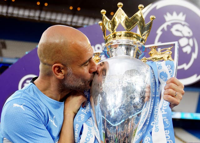 Pepe Guardiola with the Premier League trophy (Martin Rickett/PA).