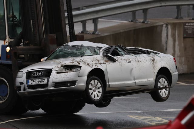 Crushed car lifted off ferry