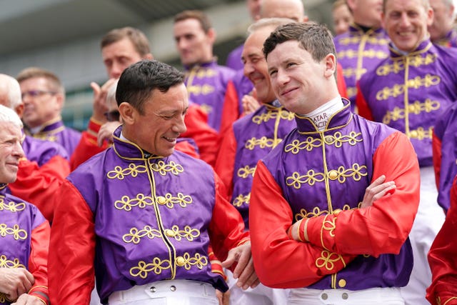 Oisin Murphy (right) took part in a parade of jockeys who had ridden for the Queen on Derby day last year