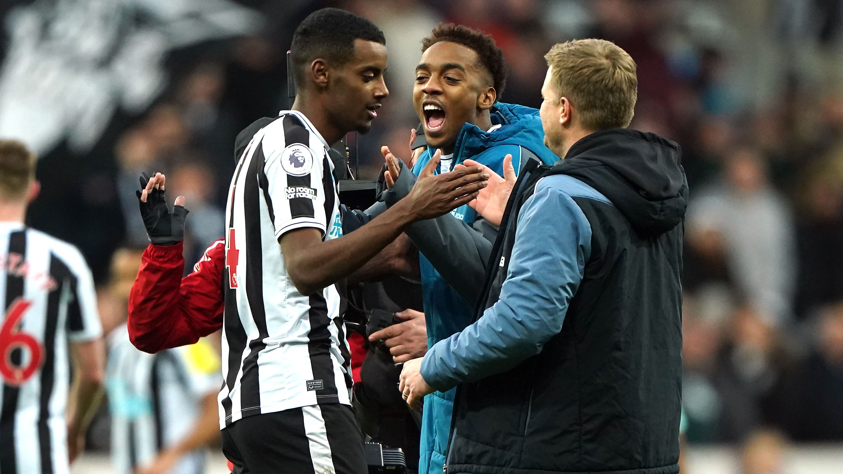 Newcastle goalscorer Alexander Isak, left, celebrates with Joe Willock, centre, and manager Eddie Howe at full-time (Owen Humphreys/PA)