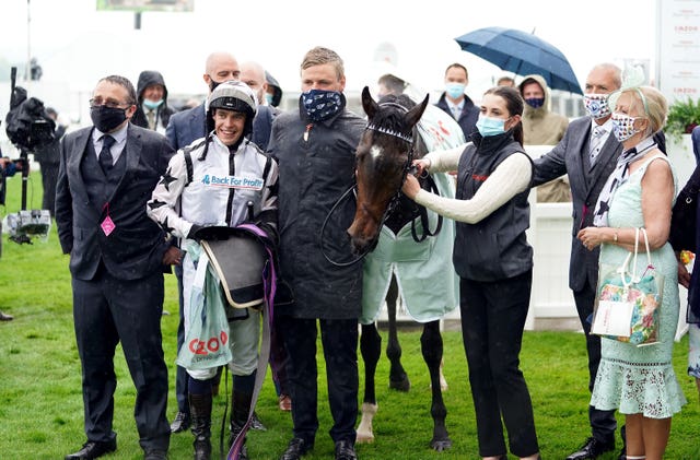 George Boughey (centre) celebrating Oscula's victory in the Cazoo Woodcote EBF Stakes at Epsom