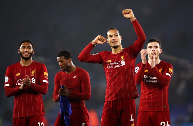 Liverpool’s Virgil Van Dijk leads the celebrations after the final whistle
