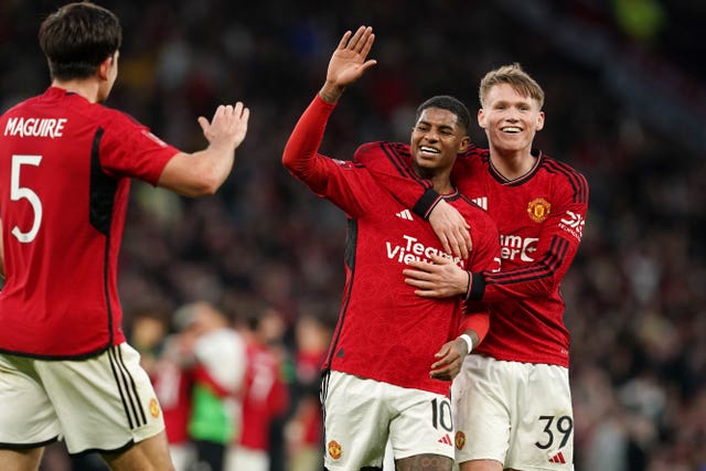 Marcus Rashford (left), Scott McTominay and Harry Maguire celebrate after the full-time whistle