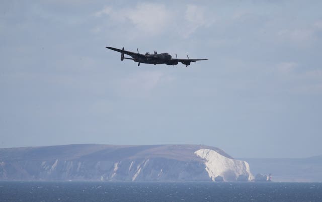 A Lancaster bomber, part of the Battle of Britain Memorial Flight, performs for the crowds on day one of the Bournemouth Air Festival 2019 on day one of the Bournemouth Air Festival