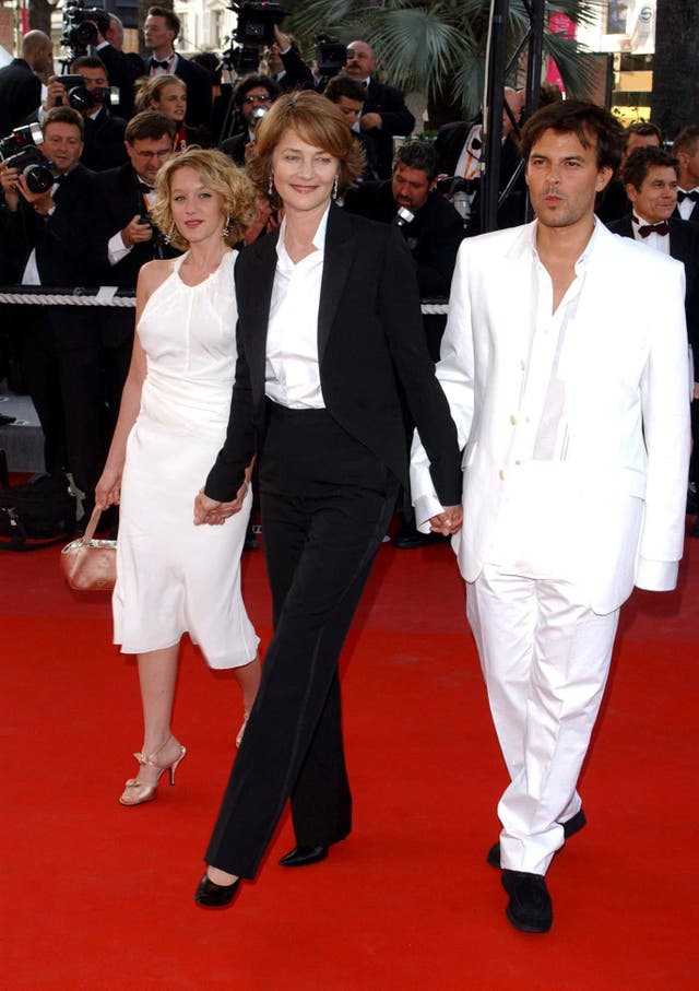 Ludivine Sagnier, Charlotte Rampling and Director Francois Ozon arrive at the premiere of their film the Swimming Pool at the Cannes Film Festival 2003 