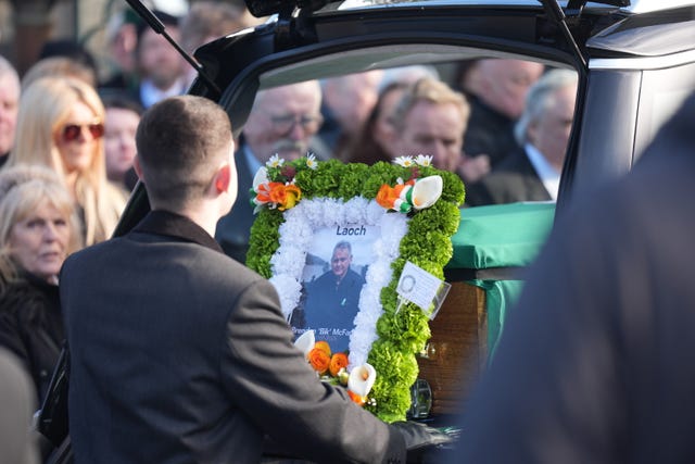 The funeral cortege arriving at Milltown Cemetery