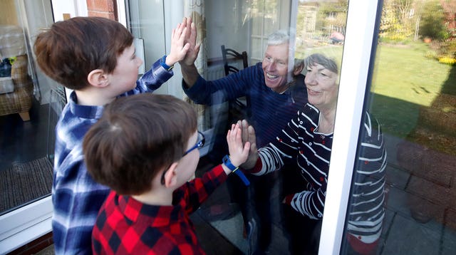 Plans could include grandparents being able to meet their grandchildren outside, reports suggest (Martin Rickett/PA)