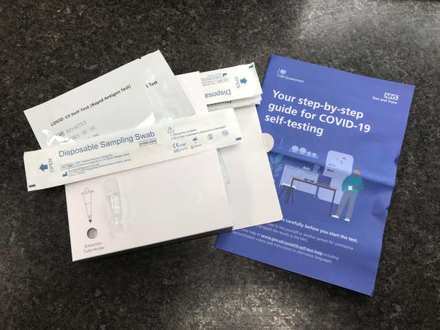 A package of seven NHS Test and Trace COVID-19 self-testing kits (Rapid Antigen Test) which has been received through the mail after ordering online for use at home
