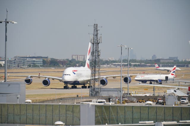 British Airways planes taxi in the heat at Heathrow Airport