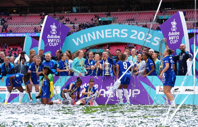 Chelsea’s Millie Bright (centre) lifts the FA Cup with her team-mates after victory over Manchester United in the Women's FA Cup final