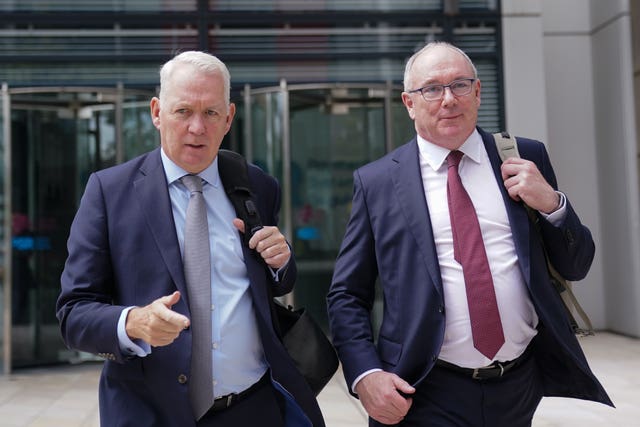 TSB chief executive Robin Bulloch, left, and David Postings, chief executive of UK Finance, leave the offices of the Financial Conduct Authority in London