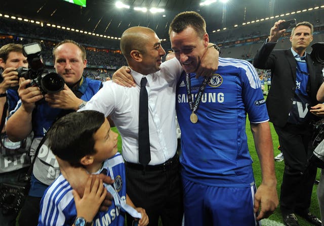 Suspended Chelsea captain John Terry, pictured interim manager Roberto Di Matteo, donned full kit to join in the celebrations