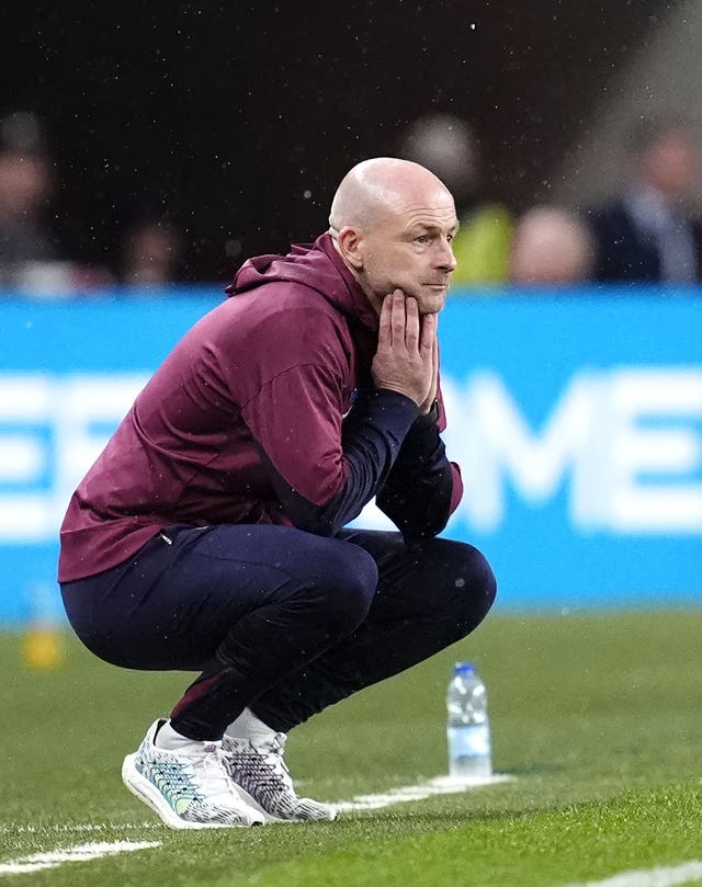 England interim manager Lee Carsley crouches on the touchline during Tuesday's win over Finland