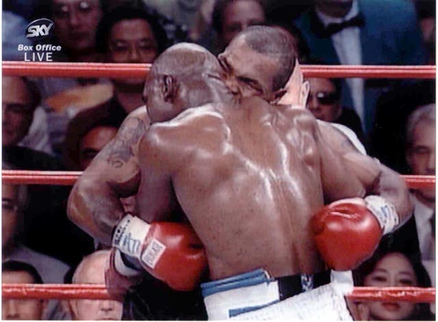 BOXING Tyson bites Holyfield