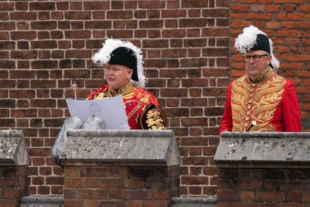 Garter Principle King of Arms, David Vines White reads the proclamation on a balcony at St James's Palace