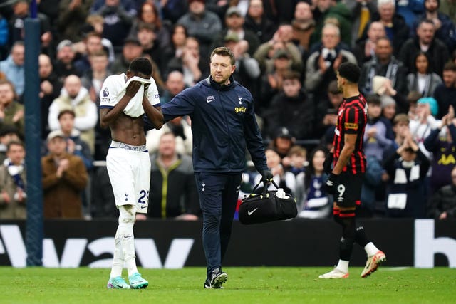 Pape Sarr, left, was distraught after suffering injury in Spurs' win over Bournemouth