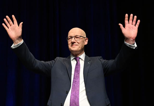 John Swinney waves 