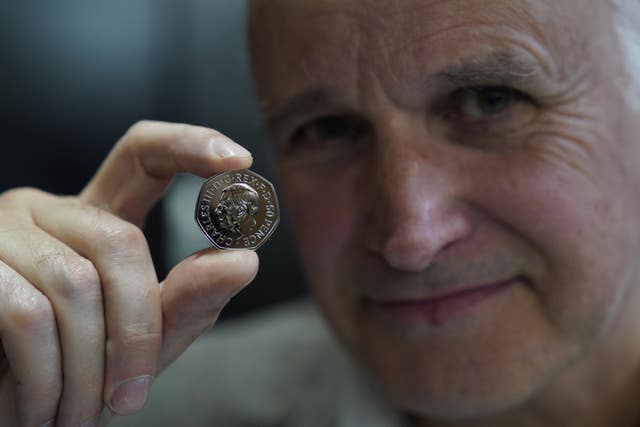 Mr Jennings with the coin (Alistair Heap/PA)
