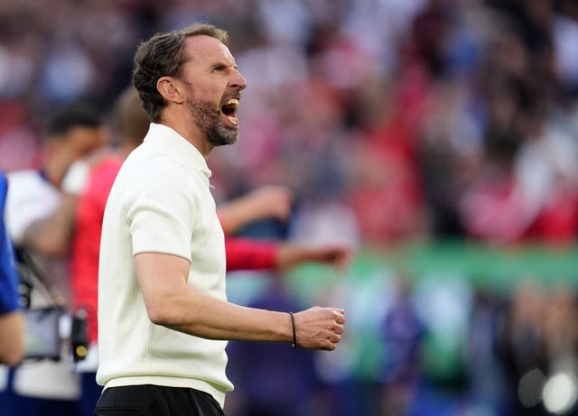 England manager Gareth Southgate punches the air in celebration after victory over Switzerland