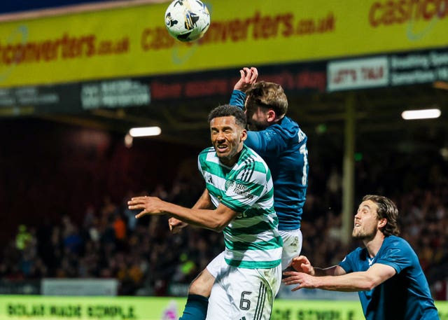 Sam Nicholson and Auston Trusty compete for an aerial ball