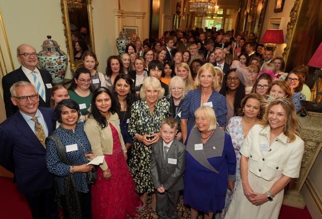 The Queen hosted community volunteers and authors at Clarence House in central London