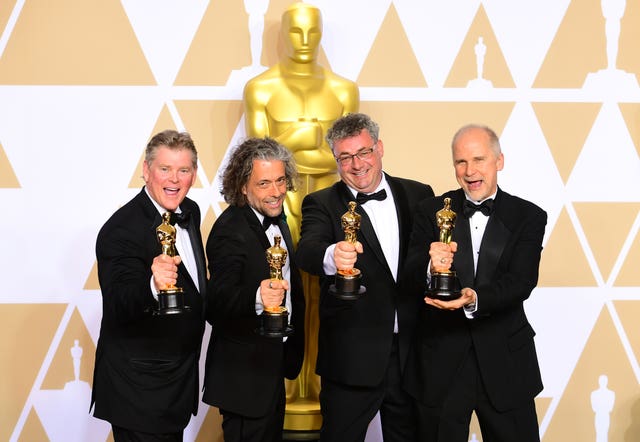 Richard R Hoover, Paul Lambert, Gerd Nefzer and John Nelson with their Best Visual Effects Oscar for Blade Runner 2049 (Ian West/PA)