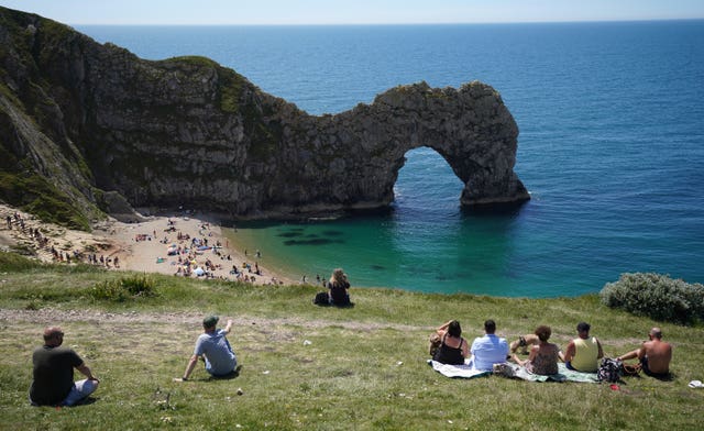 People enjoy the warm weather at Durdle Door 