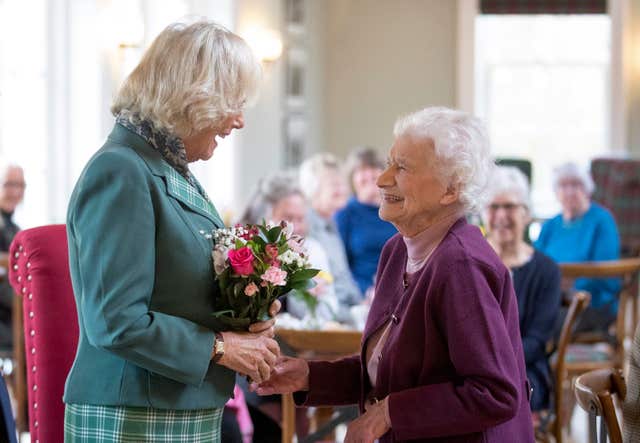 Camilla is presented with flowers