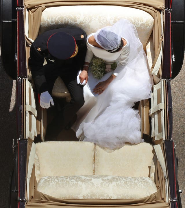 Prince Harry and Meghan Markle ride in an Ascot Landau along the Long Walk after their wedding in St George’s Chapel 