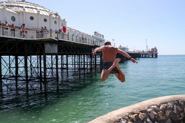 A man takes the plunge at Brighton beach