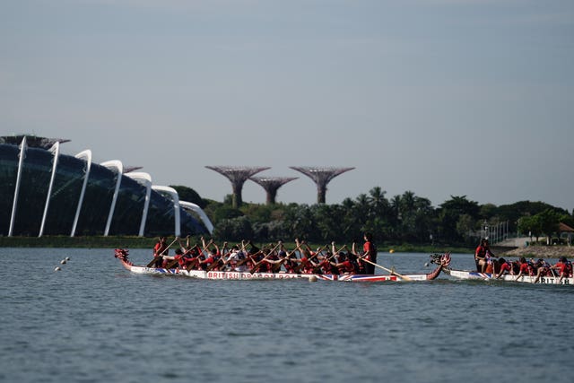 The Prince of Wales takes part in dragon boating in Singapore. 