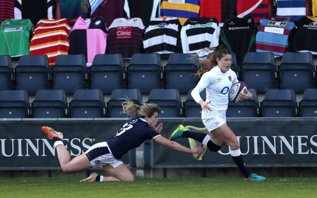 Jess Breach, right, races in for defending champions England's fifth try in their opening Women’s Guinness Six Nations match against Scotland, which they won 52-10 at Castle Park in Doncaster 