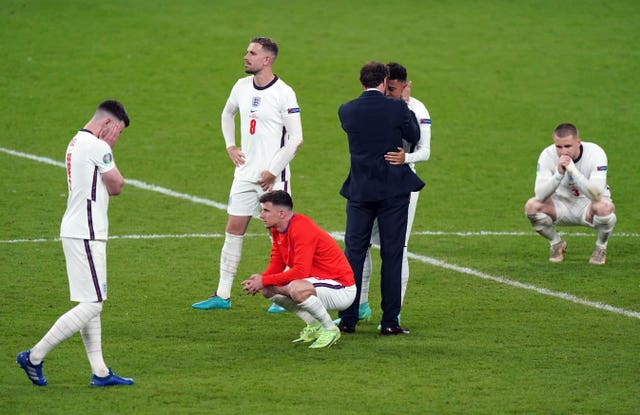 England manager Gareth Southgate consoles his players after the defeat 