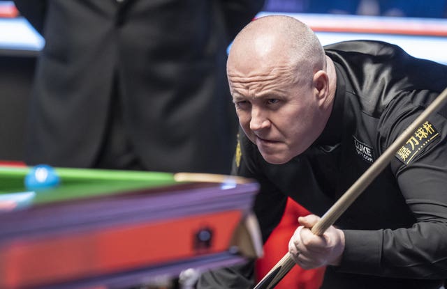 John Higgins in action during his match against Judd Trump at the UK Championship in York