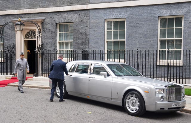 Sultan of Oman Haitham bin Tariq Al Said approaches his silver Rolls-Royce