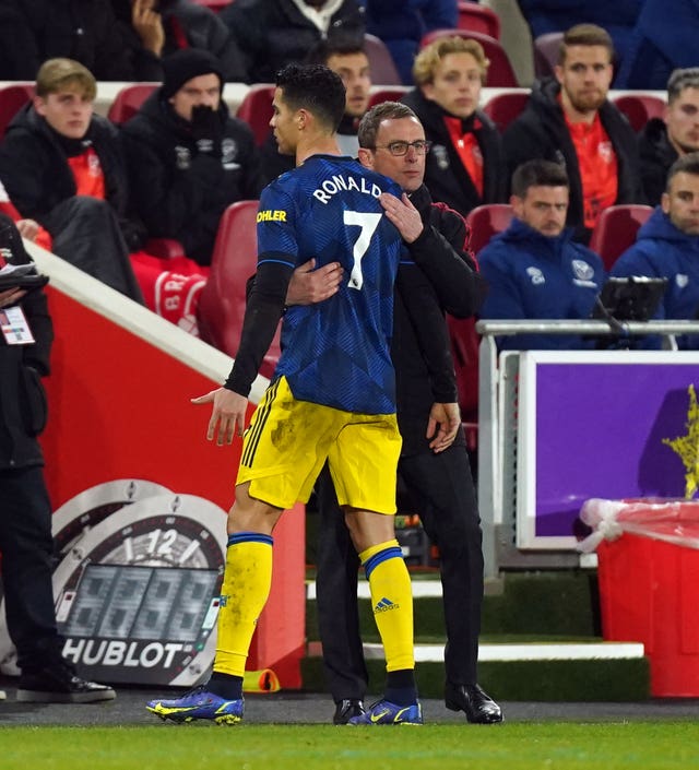 Ralf Rangnick, right, embraces Cristiano Ronaldo as he is substituted against Brentford