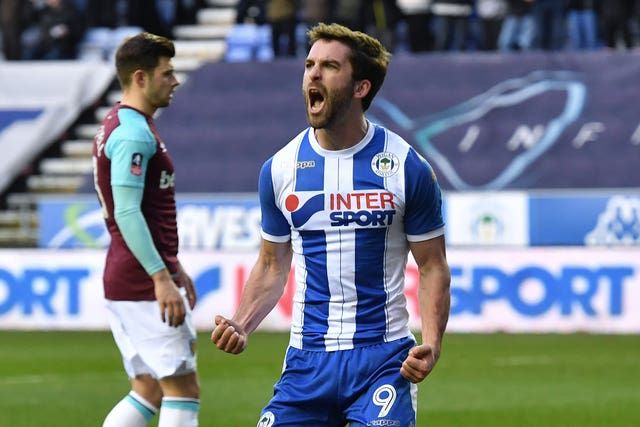 Will Grigg struck twice as Wigan knocked West Ham out of the FA Cup.