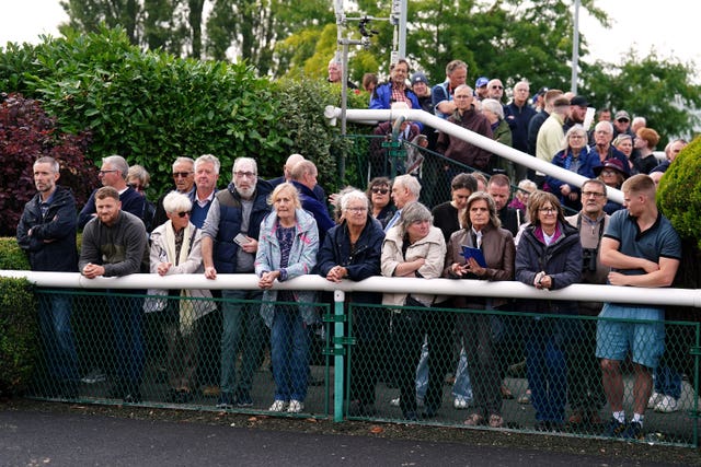 Spectators wait for City Of Troy to arrive in the parade ring 