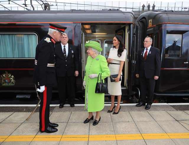 The Queen and Meghan arrive