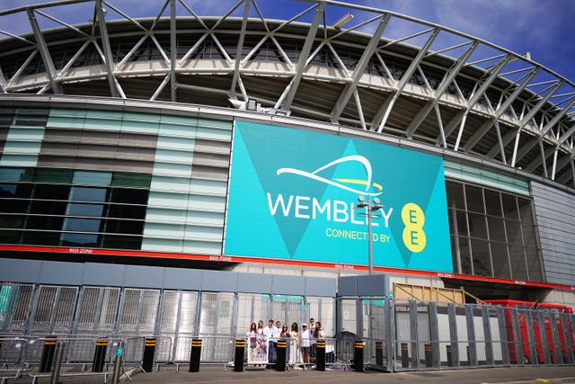 Fans waiting to enter Wembley Stadium 