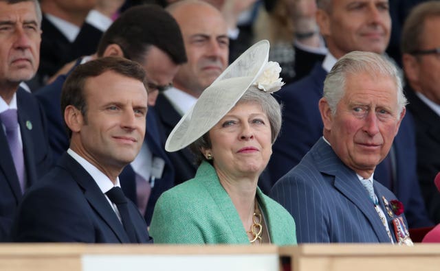 French President Emmanuel Macron, the then Prime Minister Theresa May and the Prince of Wales during 2019 commemorations in Portsmouth marking the 75th Anniversary of the D-Day landings. Andrew Matthews/PA Wire