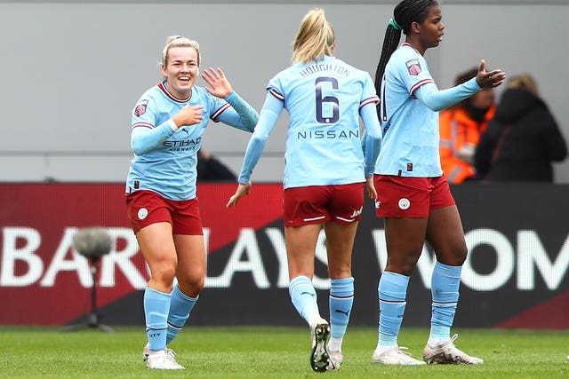 Lauren Hemp (left) celebrates scoring City's second