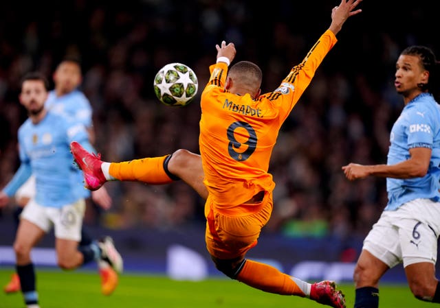 Real Madrid’s Kylian Mbappe mishits his volley but scores against Manchester City