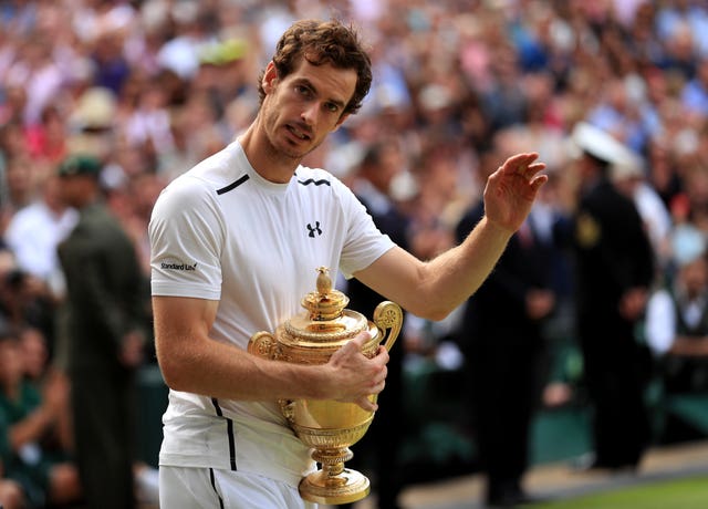 Andy Murray celebrates with the trophy after winning the Wimbledon title in 2016